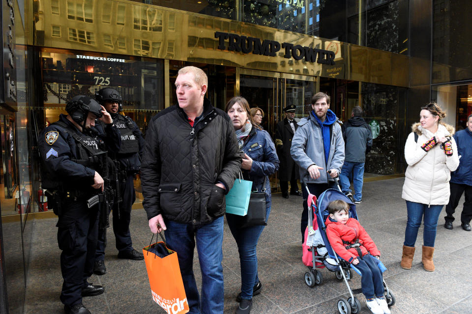 People leave Trump Tower where Republican president-elect Donald Trump lives in the Manhattan borough of New York, U.S., November 27, 2016. REUTERS/Darren Ornitz