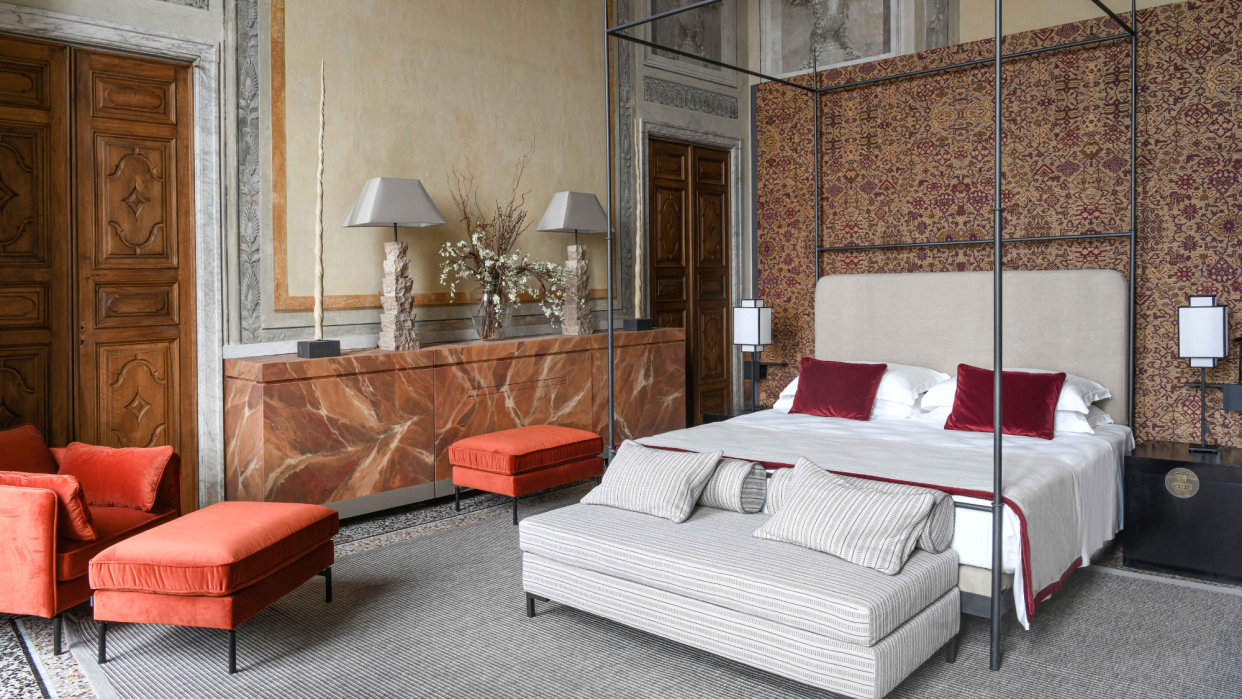  A four-poster bed in a suite at Palazzo Durazzo. 