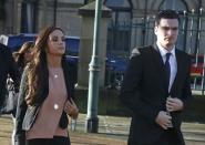 Sunderland soccer player Adam Johnson (R) arrives with his girlfriend Stacey Flounders at Bradford Crown Court in Bradford, Britain February 10, 2016. REUTERS/Andrew Yates