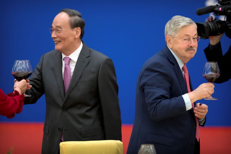 Chinese Vice President Wang Qishan, left, and U.S. Ambassador to China Terry Branstad toast during an event commemorating the 40th anniversary of the establishment of diplomatic relations between the United States and China