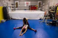 Stardom female professional wrestling guest fighter Chelsea (bottom) trains with a fellow wrestler at a boxing gym in Tokyo, Japan, October 1, 2015. REUTERS/Thomas Peter