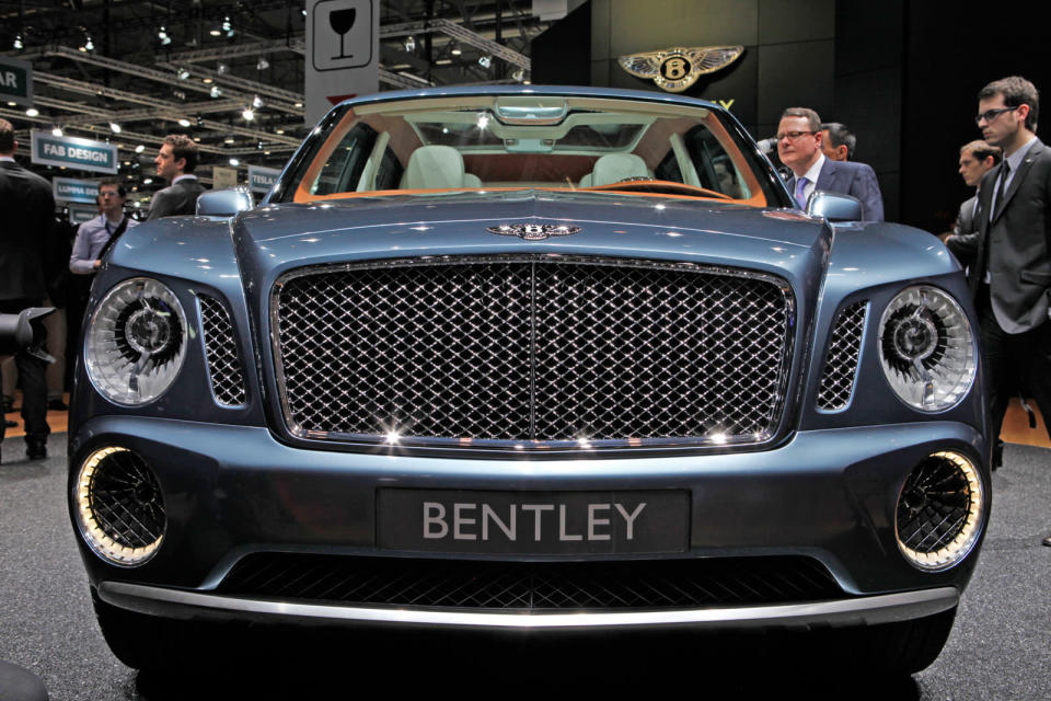 After months of rumors, Bentley revealed today a concept for its first sport utility vehicle ever: the 600-hp Bentley EXP 9 F. When it comes to vehicles for the wealthiest people in the world, restraint is so last century. With ultra-luxury vehicle sales rising on strong demand from China and the Middle East, the SUV would make the most financial sense as an addition. Given that the Continental starts around $190,000 and the Mulsanne around $280,000, it's easy to imagine a Bentley SUV with a sticker of about $250,000. Powered by a twin-turbo W-12 capable of 600 hp and 590 ft-lbs. of torque, Bentley says the EXP 9 would rank among the fastest vehicles of its kind. All that motive force gets to the ground through an 8-speed transmission and all-wheel-drive system turning 23-inch chrome wheels that are as bling-y as anything from Tire Rack. Inside lies the usual assortment of hand-stitched leathers, wood veneers and one-percentery touches like a split tailgate that folds down to reveal a custom dining set.