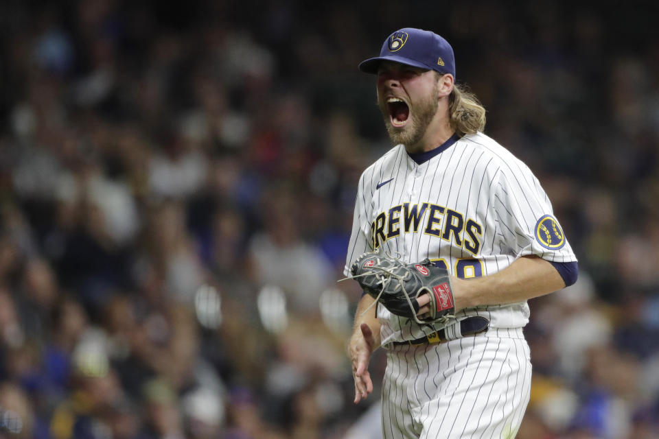 Milwaukee Brewers' Corbin Burnes reacts after striking out a batter during the seventh inning of a baseball game against the New York Mets Saturday, Sept. 25, 2021, in Milwaukee. (AP Photo/Aaron Gash)