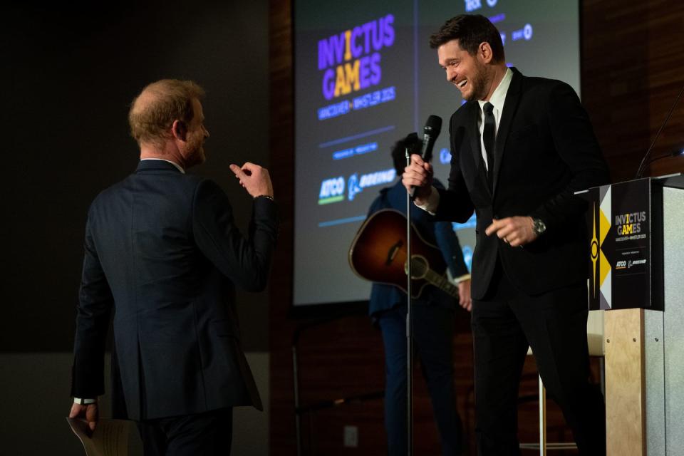 prince harry, the duke of sussex walks to the stage after canadian signer and songwriter, michael buble's performance during the 