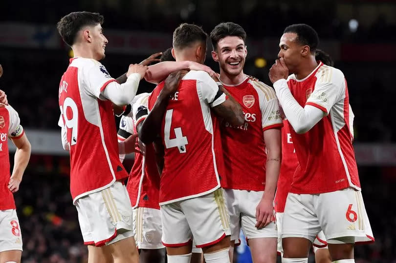 Arsenal teammates celebrate Ben White scoring against Chelsea