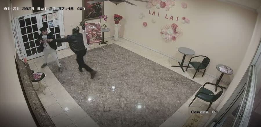 New surveillance video shows the violent struggle between the suspected Monterey Park gunman and the 26-year-old man who disarmed him at the Lai Lai Ballroom on Jan. 21, 2023. (Lai Lai Ballroom and Studio)