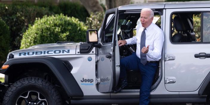 President Joe Biden gets out of a plug-in hybrid Jeep Wrangler