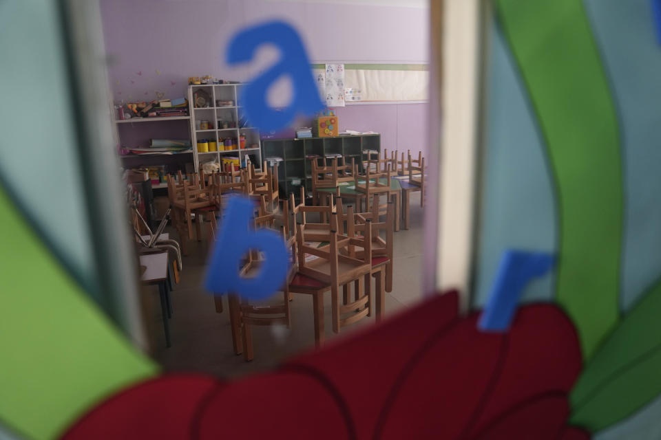 An empty classroom in a closed public school is seen in Beirut, Lebanon, Thursday, March 2, 2023. Public schools have been open for fewer than 50 days this school year because teachers are on strike, protesting dramatic currency devaluations that slashed their salaries to about $20 a month. (AP Photo/Hussein Malla)