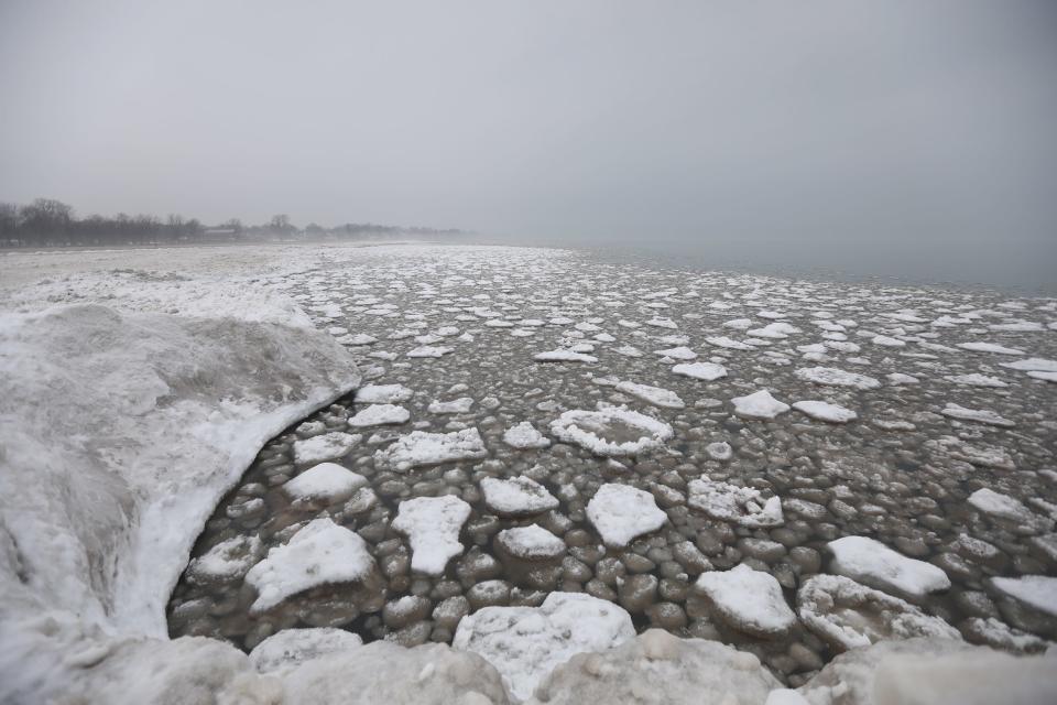 Colder temperatures created ice pancakes on Lake Ontario in Rochester, NY on Thursday, January 13, 2022.   The first few feet of the shore line is actually frozen water from the shallow end of Lake Ontario.