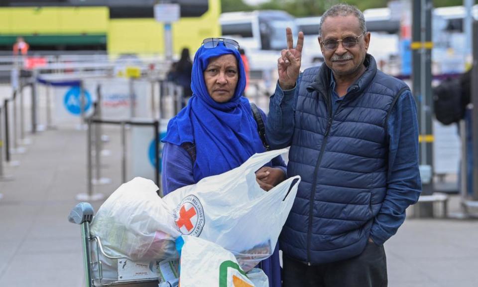 Wahied and Fatima Hassan, evacuees from Halfaya near Khartoum, Sudan, arrrive at Stansted airport.