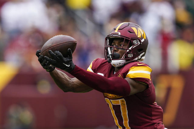 Washington Football Team wide receiver Terry McLaurin (17) spikes the ball  after scoring a touchdown during the second half of an NFL football game  against the Atlanta Falcons, Sunday, Oct. 3, 2021