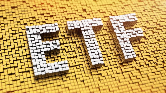 ETF spelled in white mosaic against a gold mosaic background.