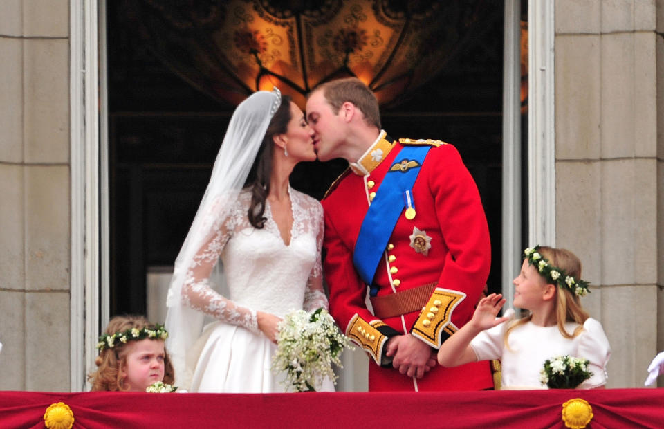 Prince William and Kate Middleton share a kiss on the balcony. <i>(Getty Images)</i>