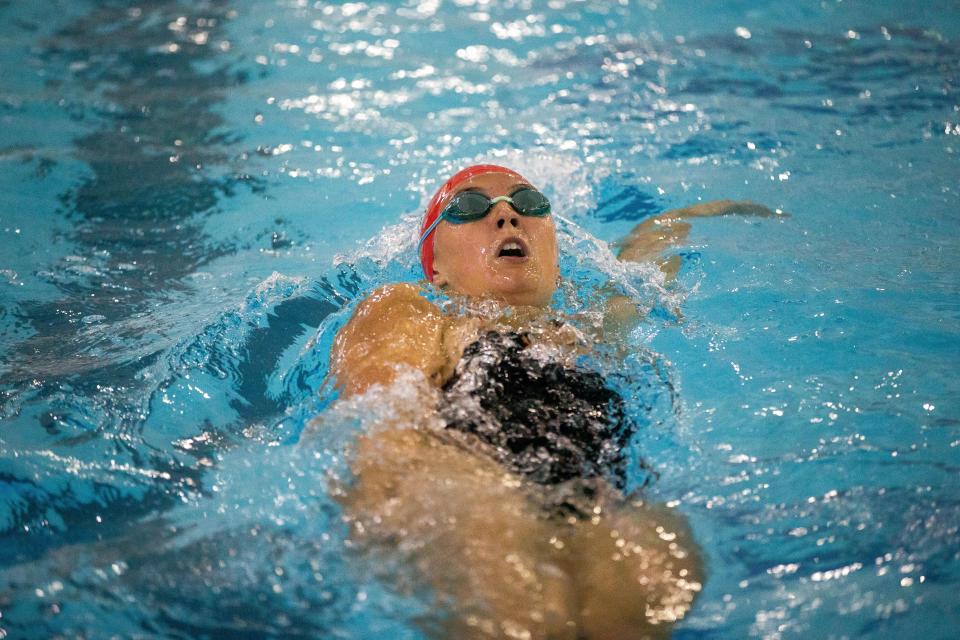Holland's Natalie Legg swims in the 100 yard backstroke Tuesday, Sept. 12, 2023, at the Holland Aquatic Center.