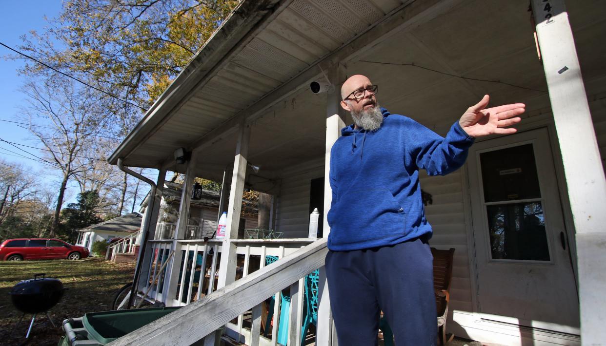 Anthony Whisnant stands on the front porch of his home on Bond Avenue in Gastonia Monday morning as he talks about helping to save the life of a gunshot victim Thanksgiving Day.