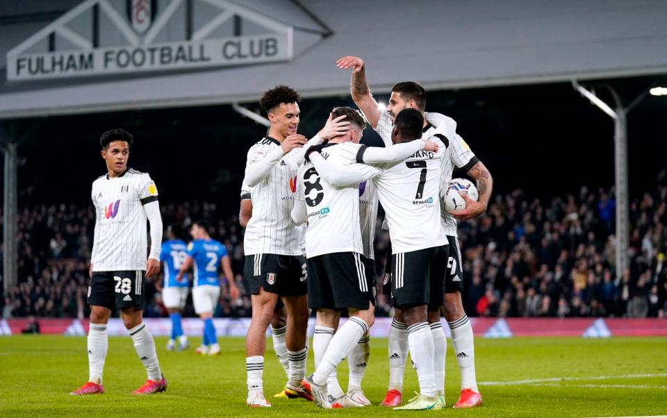 Fulham players celebrate after Birmingham City's Marc Roberts (not pictured) scores an own goal during the Sky Bet Championship match at Craven Cottage, London. - PA