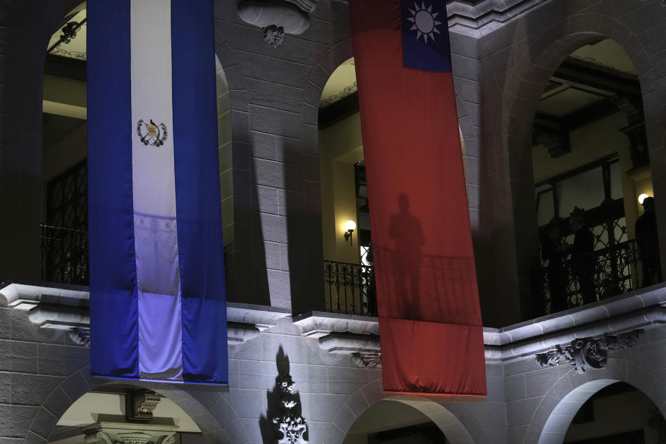 National flags representing Guatemala and Taiwan hang in the National Palace marking the visit of Taiwan's President Tsai Ing-wen, in Guatemala City, Friday, March 31, 2023. Tsai will be in Guatemala for three days before heading to Belize. (AP Photo/Moises Castillo)