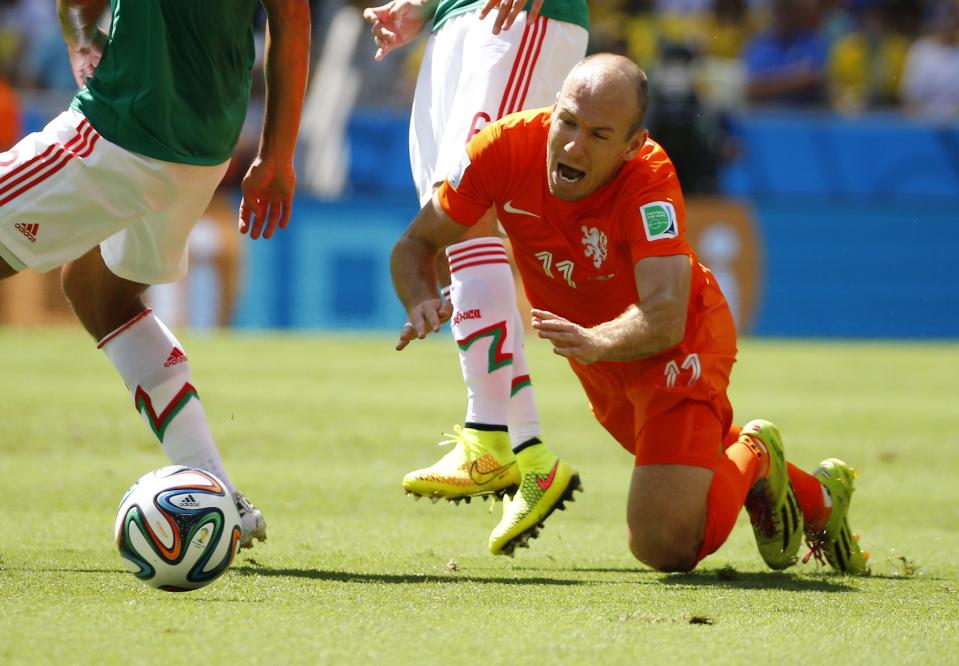 Robben of the Netherlands reacts after being fouled during their 2014 World Cup round of 16 game against Mexico at the Castelao arena in Fortaleza