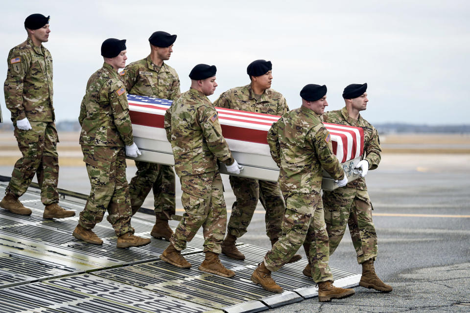 Image: An Army carry team moves the transfer case containing the remains of U.S. Army Sgt. Kennedy Ladon Sanders, 24, of Waycross, Ga.,  (Matt Rourke / AP)