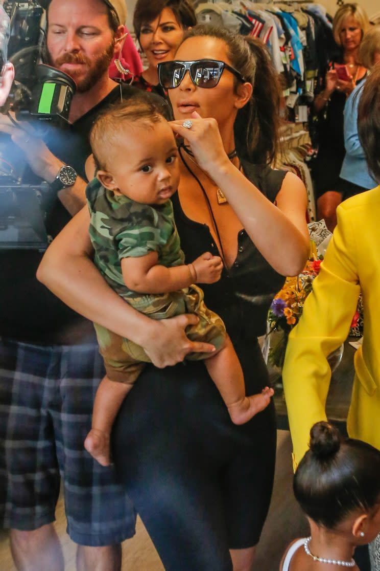 Kim Kardashian brought her son, Saint West, to grandmother Mary Jo Campbell's store opening in San Diego, Calif. (Photo: AKM-GSI)