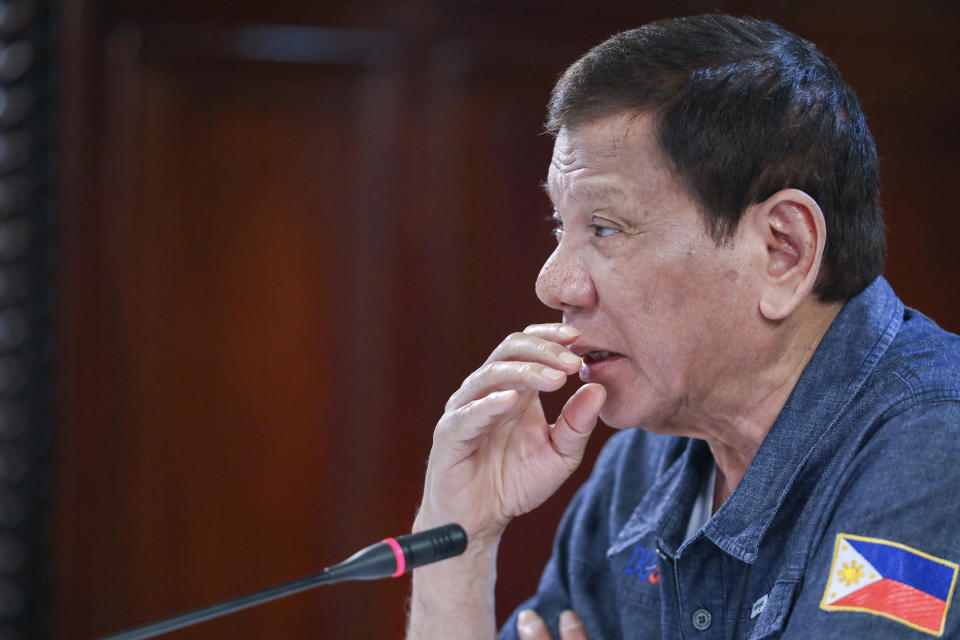 In this May 11, 2020, photo provided by the Malacanang Presidential Photographers Division, Philippine President Rodrigo Duterte talks during a meeting at the Malacanang presidential palace in Manila, Philippines. The Philippine president says a massive lockdown that has restricted millions to their homes will be eased but warned those who will be allowed to go back to work to follow safeguards to avoid more deaths and a second wave of COVID-19 outbreaks. (Ace Morandante/Malacanang Presidential Photographers Division via AP)