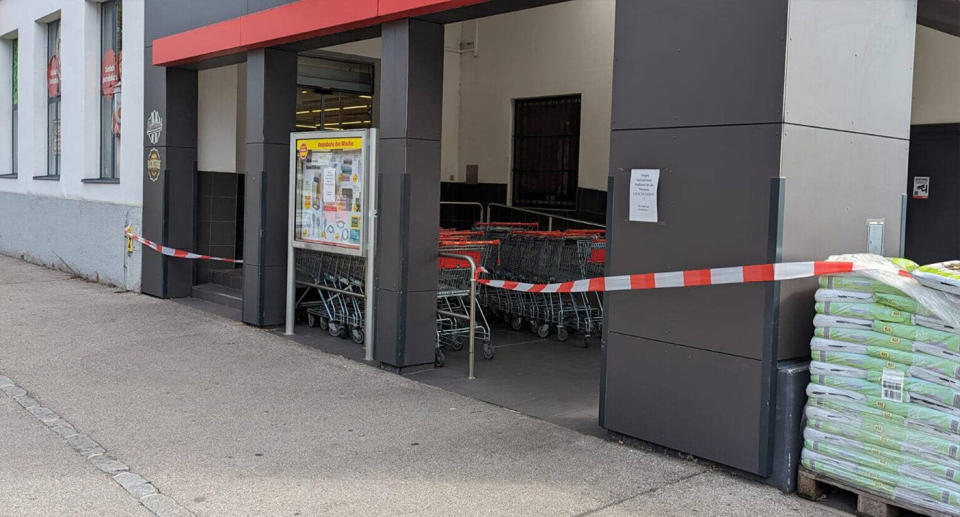 The PENNY supermarket with red closed tape outside the store. Source: NON