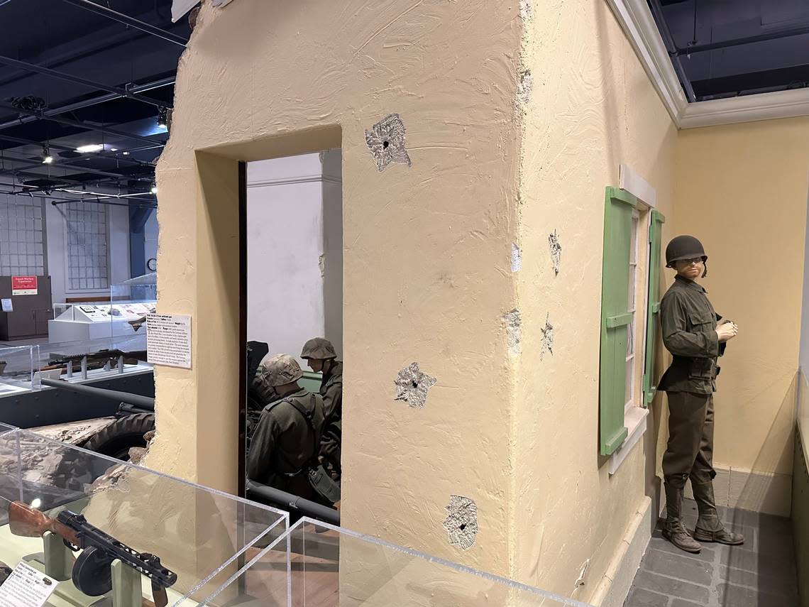 This display in the Curtis Earl Weapons Exhibit shows an American soldier sneaking up on German soldiers in a bombed-out European house. The bullet holes are authentic. Then-museum director Ken Swanson took the display items out to the desert and shot them with real bullets. Scott McIntosh/smcintosh@idahostatesman.com