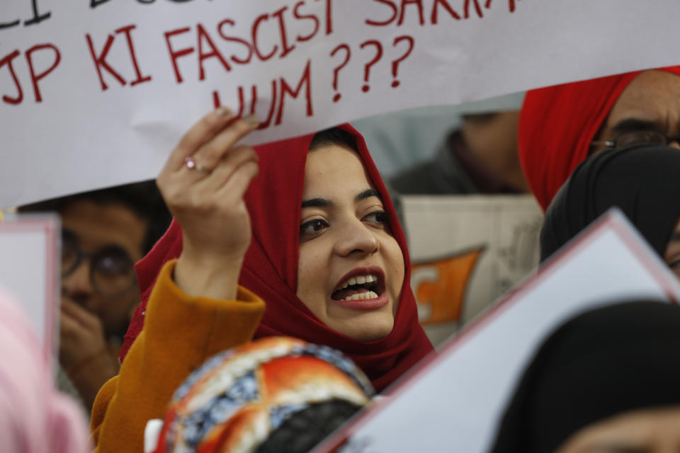 A student shouts slogans against government during a protest against a new citizenship law in New Delhi, India, Tuesday, Dec. 24, 2019. Hundreds of students marched Tuesday through the streets of New Delhi to Jantar Mantar, an area designated for protests near Parliament, against the new citizenship law, that allows Hindus, Christians and other religious minorities who are in India illegally to become citizens if they can show they were persecuted because of their religion in Muslim-majority Bangladesh, Pakistan and Afghanistan. It does not apply to Muslims. (AP Photo/Manish Swarup)