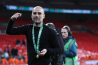 Manchester City's head coach Pep Guardiola celebrates after winning the English League Cup Final soccer match between Aston Villa and Manchester City, at Wembley stadium, in London, England, Sunday, March 1, 2020. (AP Photo/Alastair Grant)