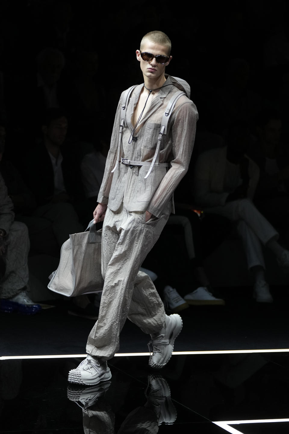 A model wears a creation as part of the Emporio Armani men's Spring Summer 2024 collection presented in Milan, Italy, Saturday, June 17, 2023. (AP Photo/Luca Bruno)
