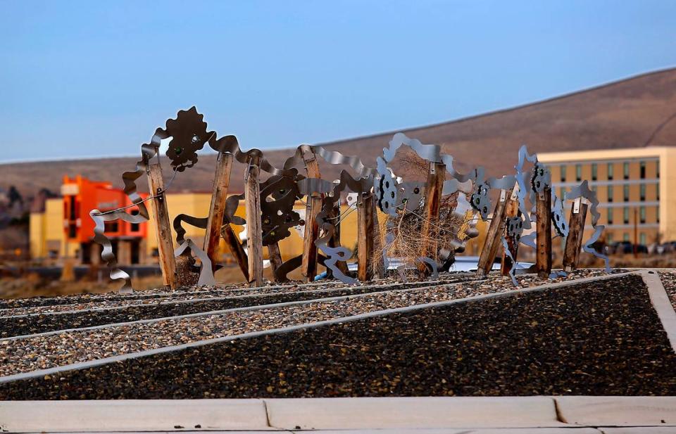 “Waves of Viticulture,” is a low-slung metal piece inspired by the region’s vineyards, in the roundabout at Queensgate/I-182 interchange.