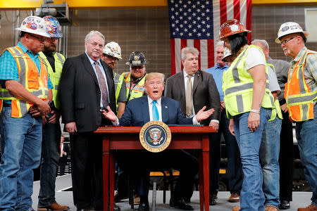 U.S. President Donald Trump speaks as he signs an executive order on energy and infrastructure during a campaign event at the International Union of Operating Engineers International Training and Education Center in Crosby, Texas, U.S., April 10, 2019. REUTERS/Carlos Barria