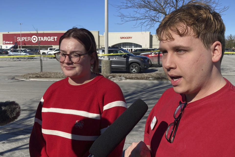 Target employees Lauren Murphy and Samuel Jacobsen speak to reporters on Tuesday, Jan. 31, 2023, after a man entered the Omaha, Neb., store where they worked with a gun and began firing before he was fatally shot by police. (AP Photo/Josh Funk)