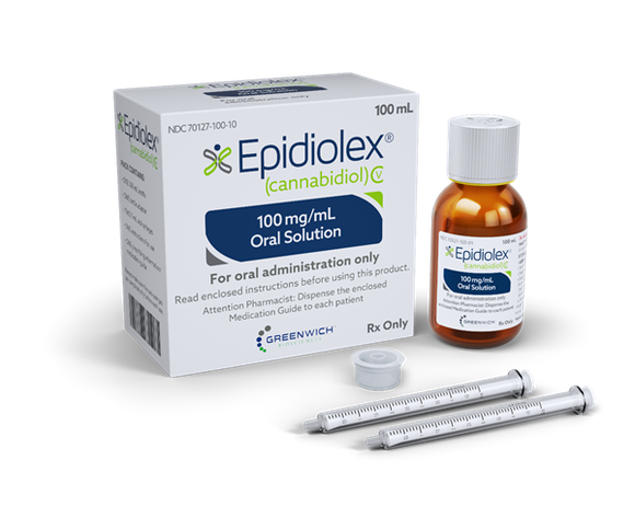 A bottle of Epidiolex next to its packaging and two droppers.