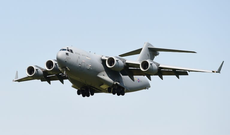 A Royal Air Force C-17 military transporter plane lands at RAF Brize Norton in Oxfordshire carrying the coffins of eight of thirty Britons killed in last week's jihadist attack in Tunisia on July 1, 2015