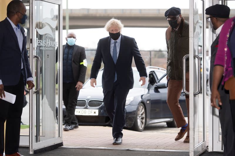 Britain's Prime Minister Boris Johnson visits a COVID-19 vaccination centre, in London