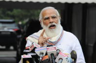 Indian Prime Minister Narendra Modi addresses the media as he arrives at the Parliament in New Delhi, India, Monday, Sept.14, 2020. Indian lawmakers have returned to Parliament after more than five months even as coronavirus cases continue to surge at the fastest pace than anywhere else in the world. (AP Photo)