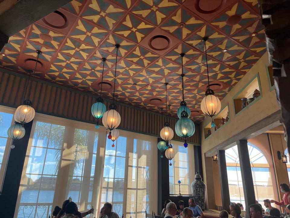 interior shot of ceiling and light fixtures in la hacienda de san angel in disney world