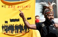 Protester speaks during a demonstration outside of the Shell headquarters, in The Hague