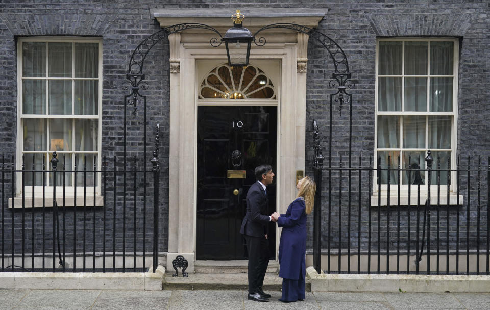 Britain's Prime Minister Rishi Sunak, left, welcomes Italian Prime Minister Giorgia Meloni to 10 Downing Street in London, Thursday, April 27, 2023. (James Manning/PA via AP)
