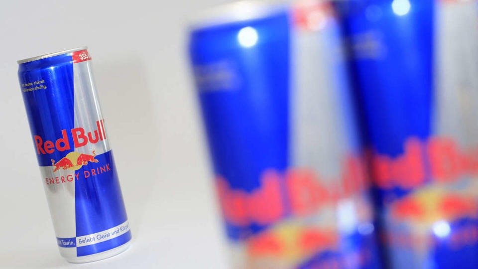 Austrian beverage energy drink cans of Red Bull are pictured in Vienna on March 16, 2013. Red Bull said that an unknown person has been attempting for several weeks to blackmail it by claiming to have contaminated its beverages with faeces.     AFP PHOTO / ALEXANDER KLEIN (Photo by ALEXANDER KLEIN / AFP)