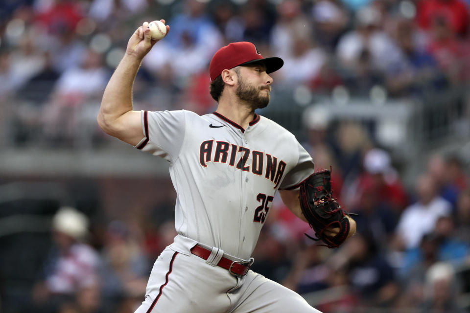 Arizona Diamondbacks' Corbin Martin throws a pitch against the Atlanta Braves during the first inning of a baseball game Saturday, July 30, 2022, in Atlanta. (AP Photo/Butch Dill)