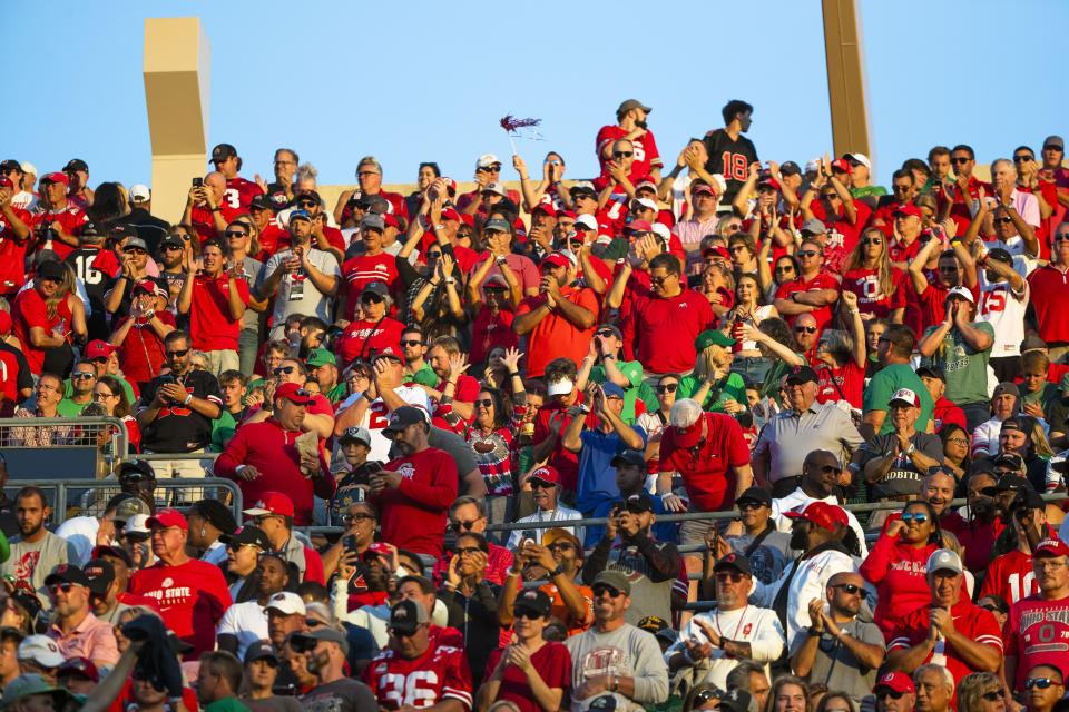 FILE - Ohio State fans cheer during the first half of an NCAA college football game against Notre Dame, Sept. 23, 2023, in South Bend, Ind. Ohio State and Nebraska are opening one or more of their preseason practices and charging admission. (AP Photo/Michael Caterina, File)