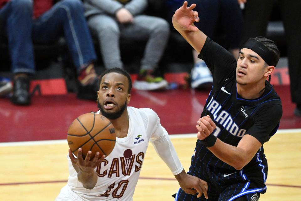 Cavaliers guard Darius Garland drives to the basket against Orlando Magic guard Anthony Black in the fourth quarter, Feb. 22, 2024, in Cleveland.