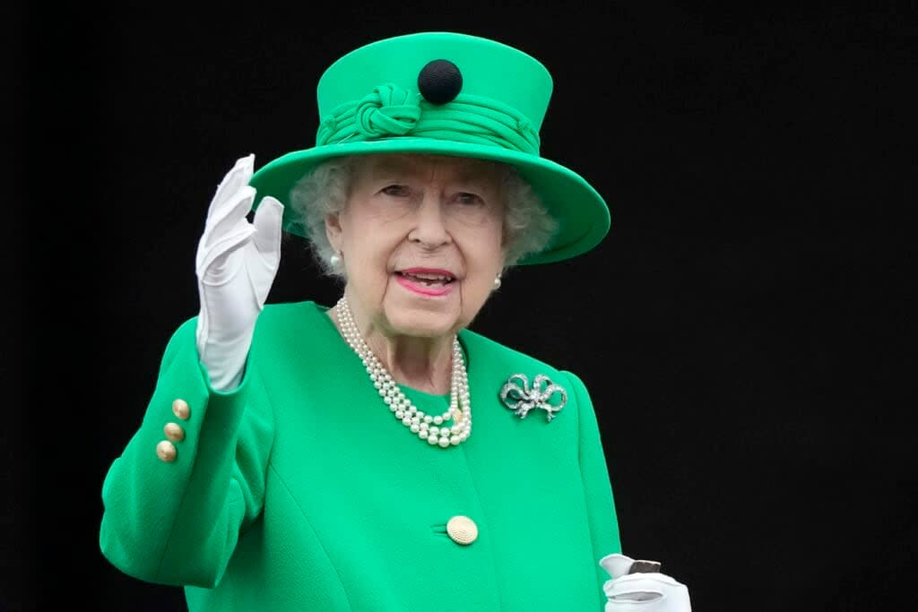 FILE – Queen Elizabeth II waves to the crowd during the Platinum Jubilee Pageant at the Buckingham Palace in London, Sunday, June 5, 2022, on the last of four days of celebrations to mark the Platinum Jubilee. Queen Elizabeth II, Britain’s longest-reigning monarch and a rock of stability across much of a turbulent century, has died. She was 96. Buckingham Palace made the announcement in a statement on Thursday Sept. 8, 2022. (AP Photo/Frank Augstein, File)