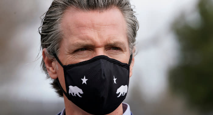 Gov. Gavin Newsom wears a face mask in Sacramento, Calif., on Feb. 11, 2021.