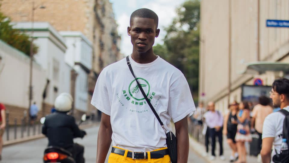 Model Ismael Savane pictured in an Air Afrique T-shirt during Paris Fashion Week Mens Spring-Summer 2023 on June 23, 2022 in Paris. - Melodie Jeng/Getty Images