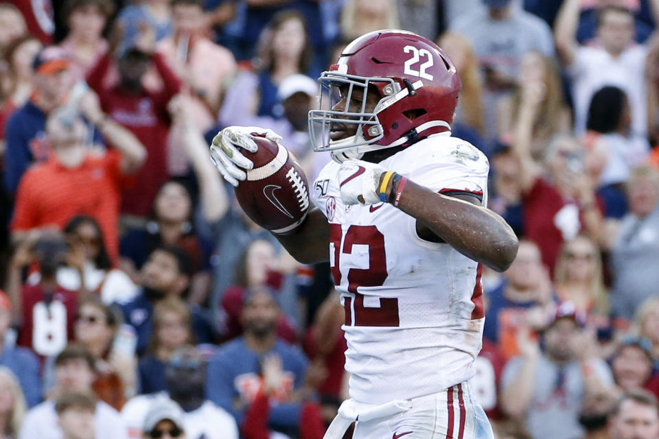 Alabama running back Najee Harris (22) celebrates after touchdown during the first half of an NCAA college football game against Auburn Saturday, Nov. 30, 2019, in Auburn, Ala. (AP Photo/Butch Dill)