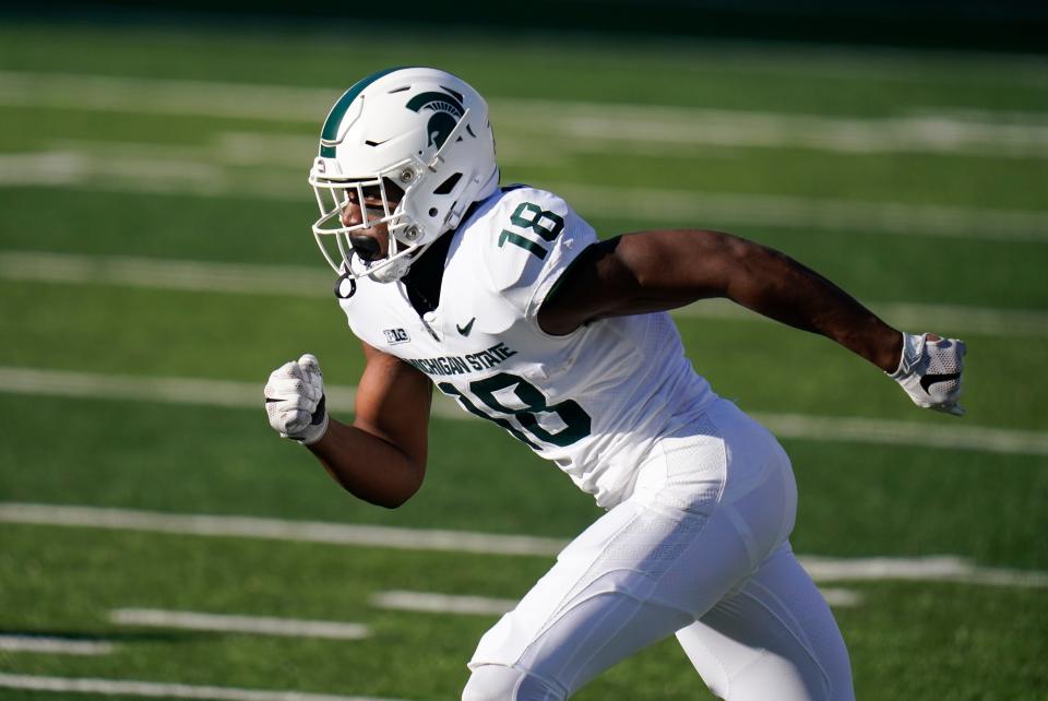 Michigan State wide receiver Tre'Von Morgan runs up field during the second half of a game against Iowa, Nov. 7, 2020, in Iowa City. (AP Photo/Charlie Neibergall)