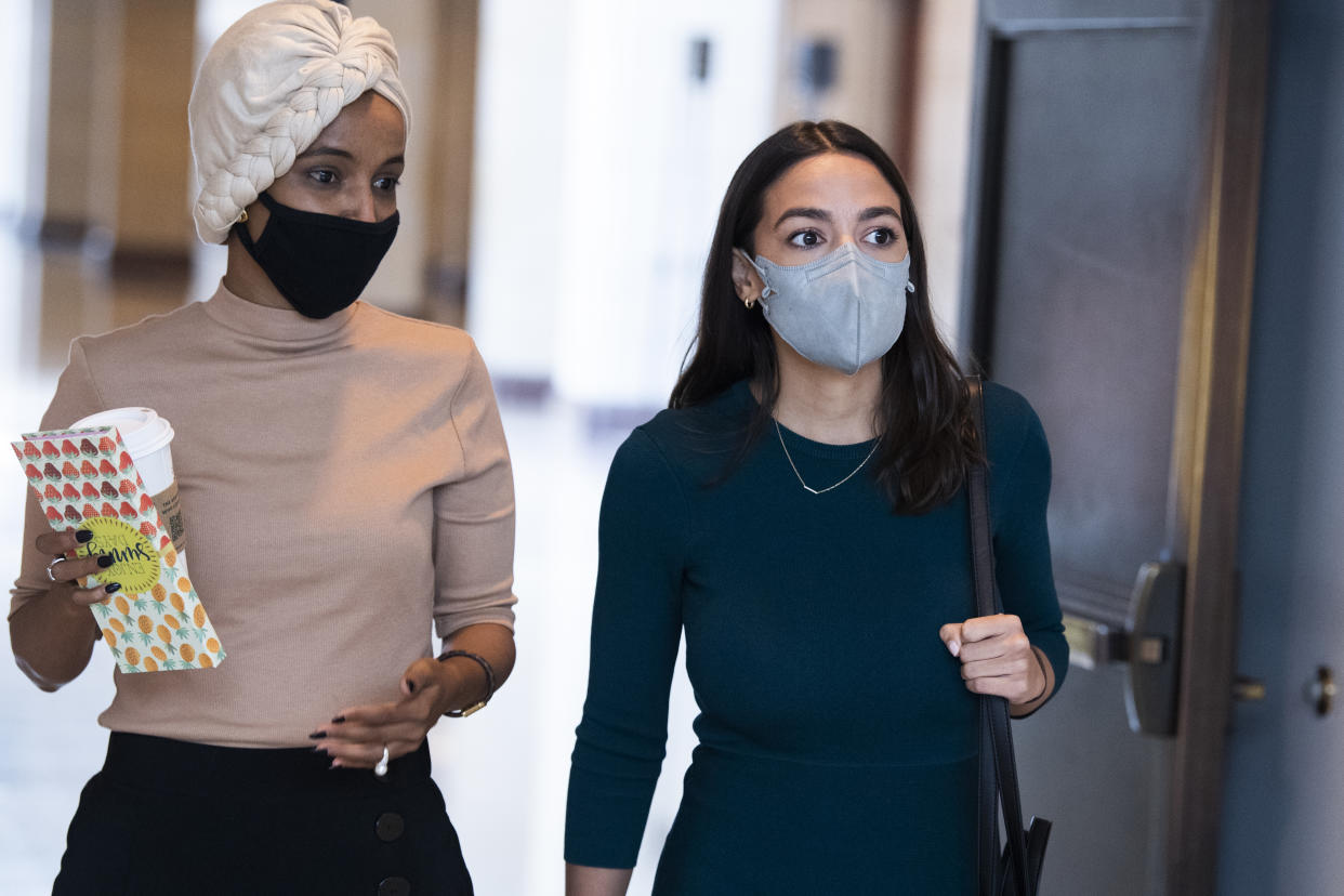 Reps. Alexandria Ocasio-Cortez, right, and Ilhan Omar are seen after a briefing by administration leaders on August 24, 2021. (Photo By Tom Williams/CQ-Roll Call, Inc via Getty Images)